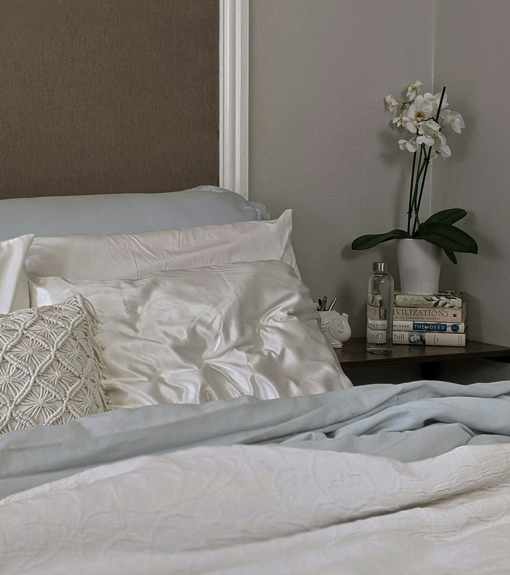 Silk pillowcase on bed in a calm bedroom setting