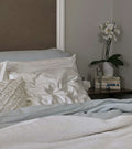 Silk pillowcase on bed in a calm bedroom setting