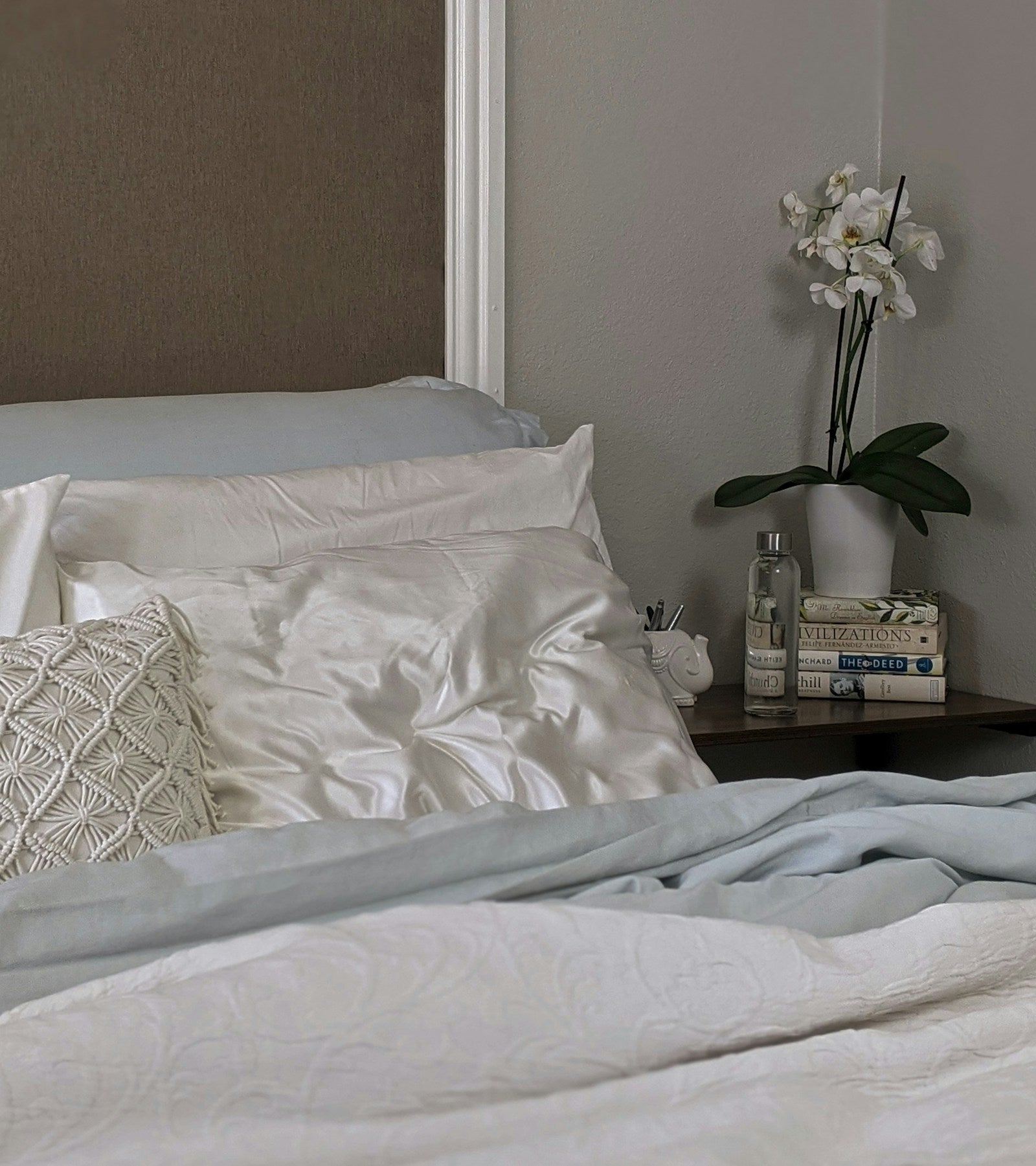 Silk pillowcase on bed in a calm bedroom setting