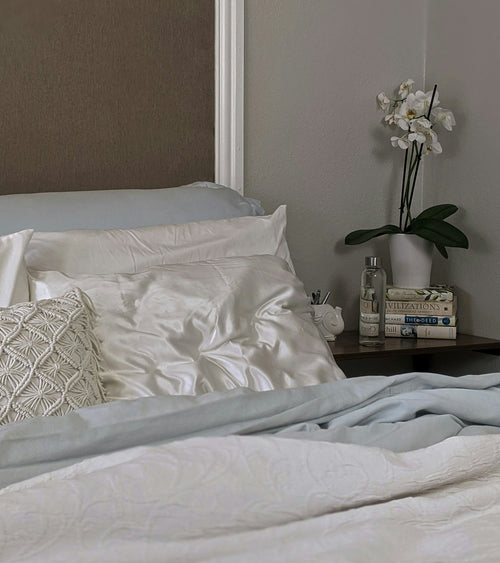 Silk pillowcase on bed in a calm bedroom setting